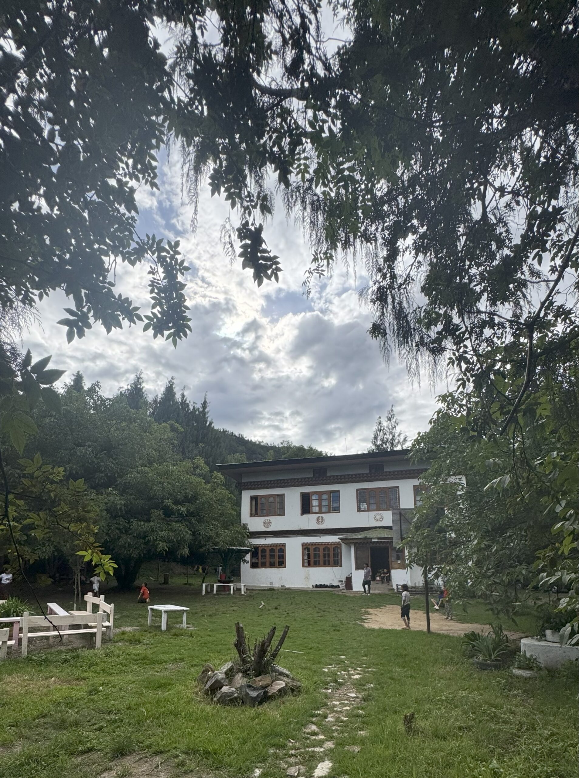 Current Nazhoen Lamtoen children’s shelter surrounded by trees and an outdoor garden area.