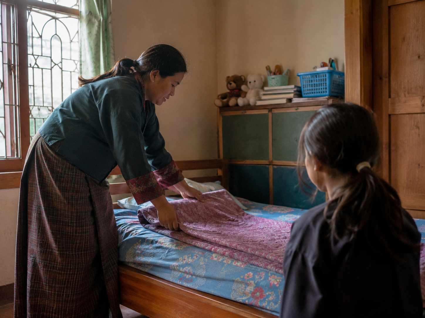 A caregiver preparing a safe and welcoming bedroom for a child staying at the shelter - placeholder