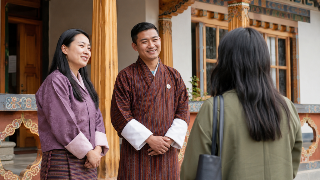 Nazhoen Lamtoen staff welcoming a visitor outside a Bhutanese office building